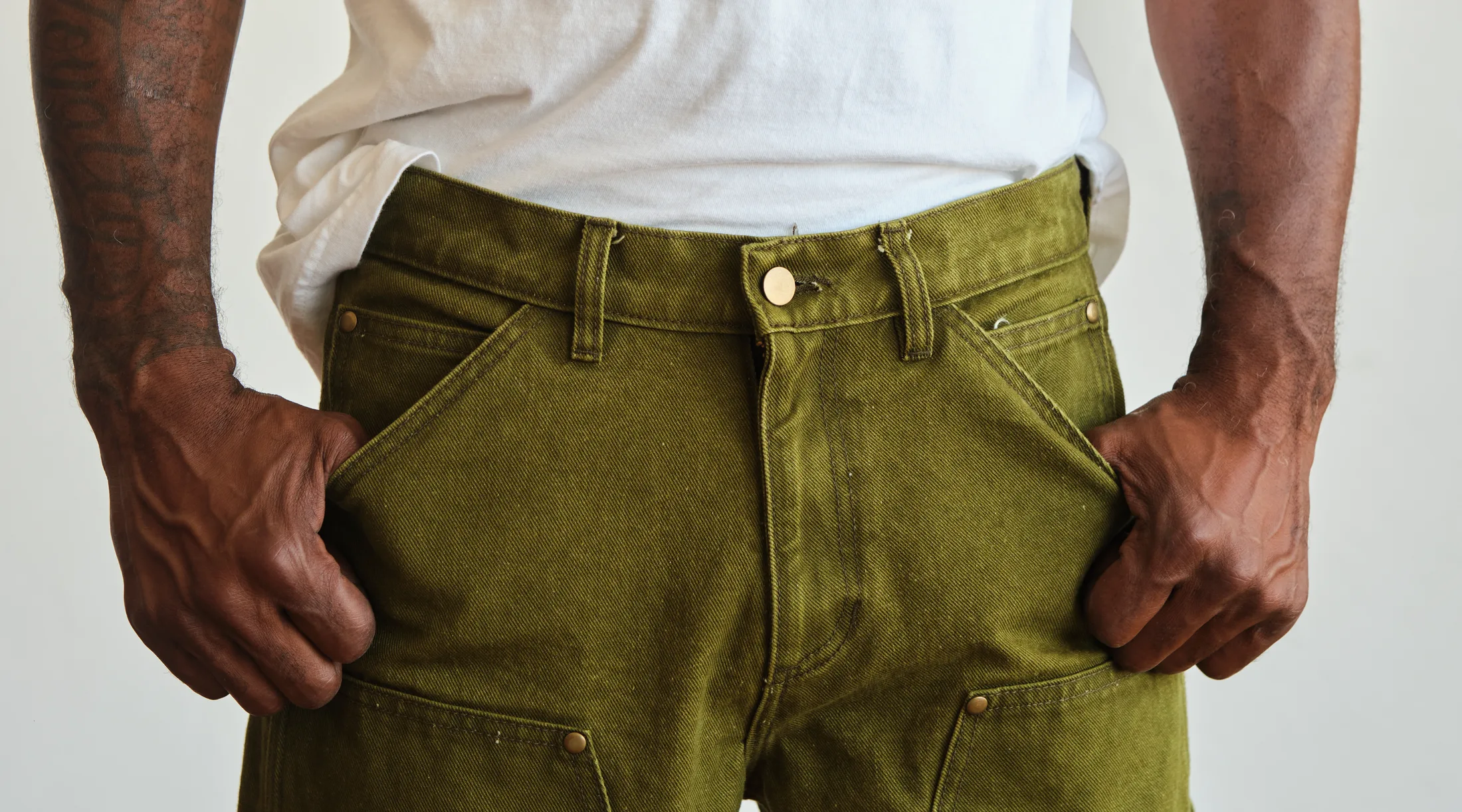 WTRLSS olive carpenter pants — a clean solid color dyed dry, repeatable run to run