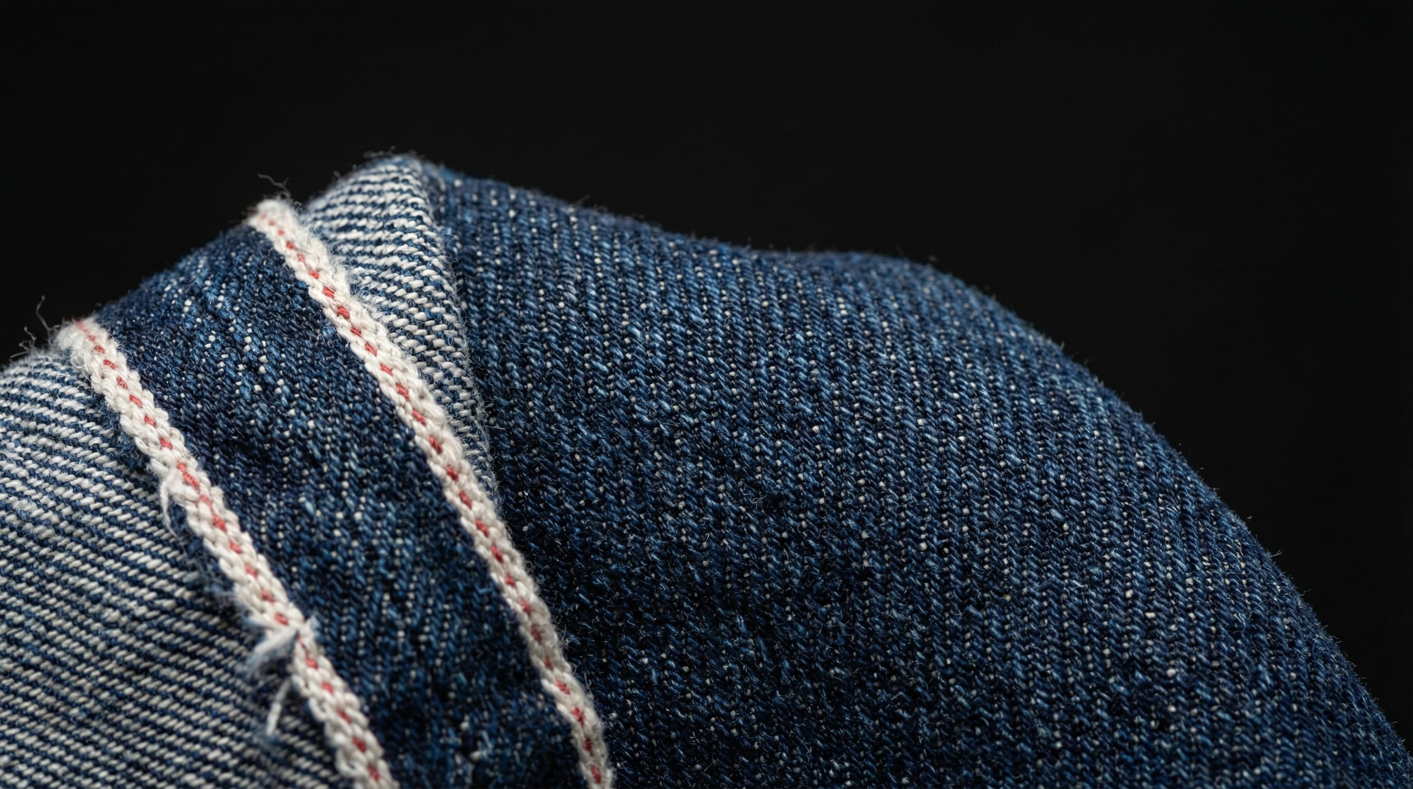 WTRLSS denim macro — fiber-level dye depth