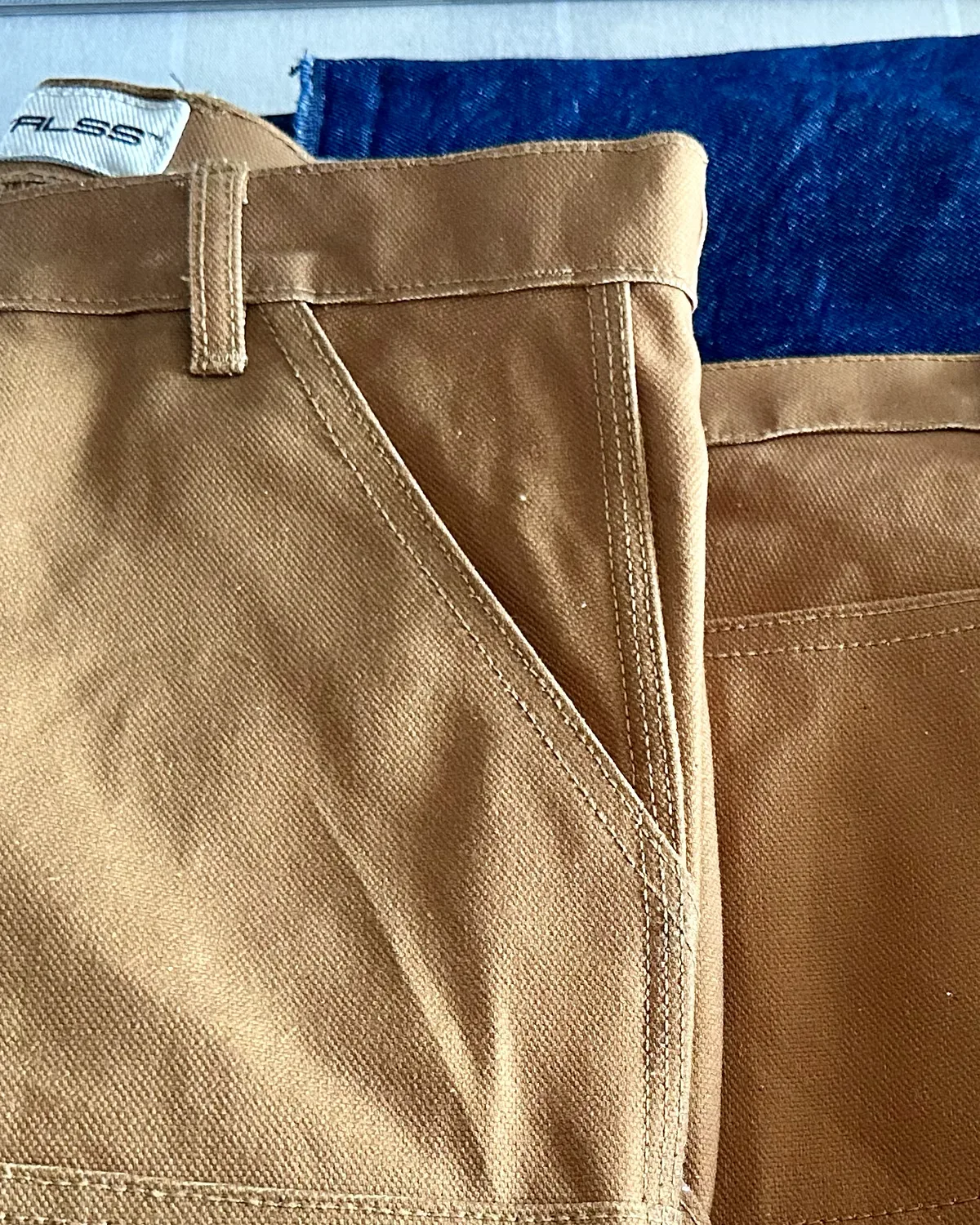 WTRLSS tan carpenter pant — pocket and stitching detail