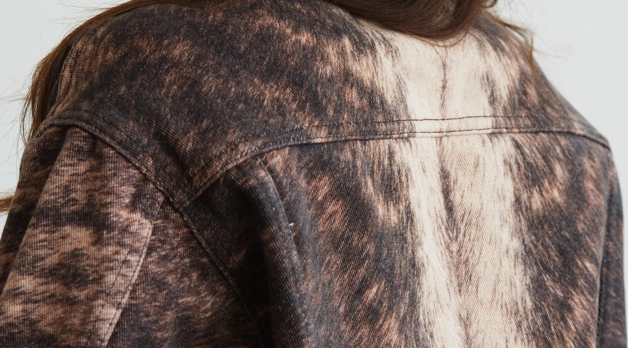 WTRLSS brown marbled acid-wash denim jacket back — an impossible cowhide-like finish achieved dry