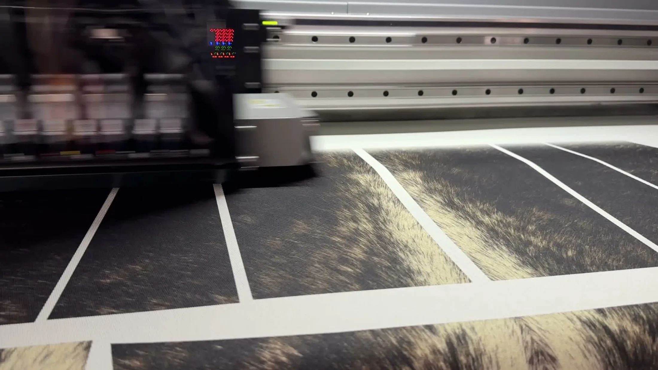 The WTRLSS Panthera S4 print carriage laying a marbled pattern across denim panels — true digital dyeing in motion