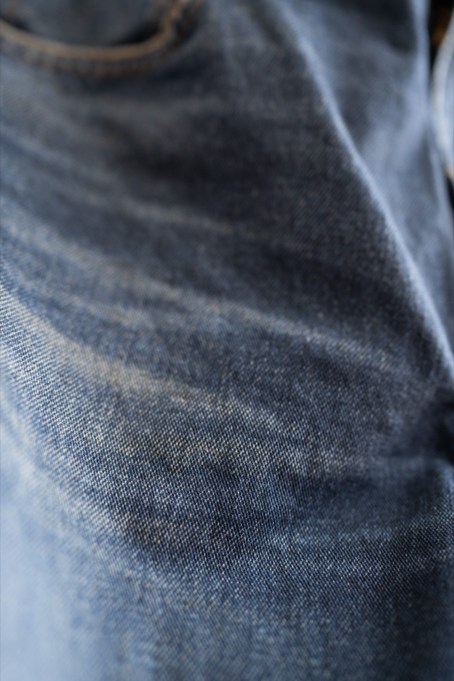 Blue denim sample showing digitally-controlled fading, whisker contrast, brightness and shade range