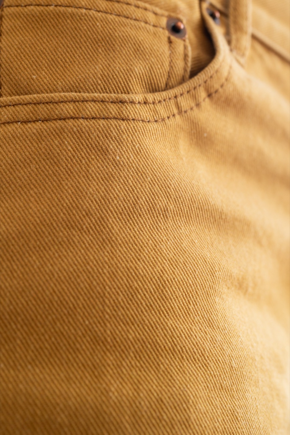 Khaki pant sample produced with 100% color consistency — no garment dye, no intensive wash cycles